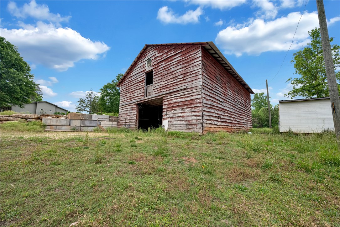 433 Latham Road Easley, SC 29640 - Photo 48 of 50 A classic rustic barn with weathered siding anchors this verdant countryside property.