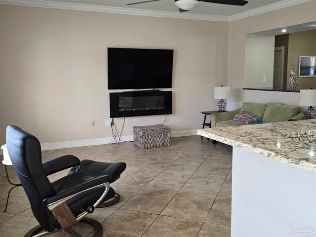 a living room with couch and a flat screen tv