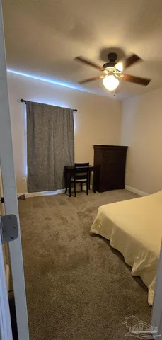 a bedroom with a bed and a cabinets