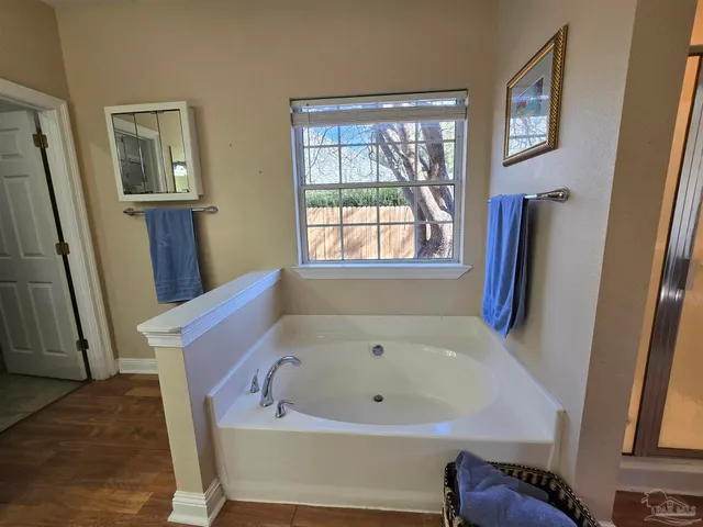 a bath tub sitting next to a window