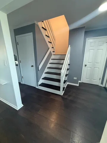 a view of a hallway with staircase