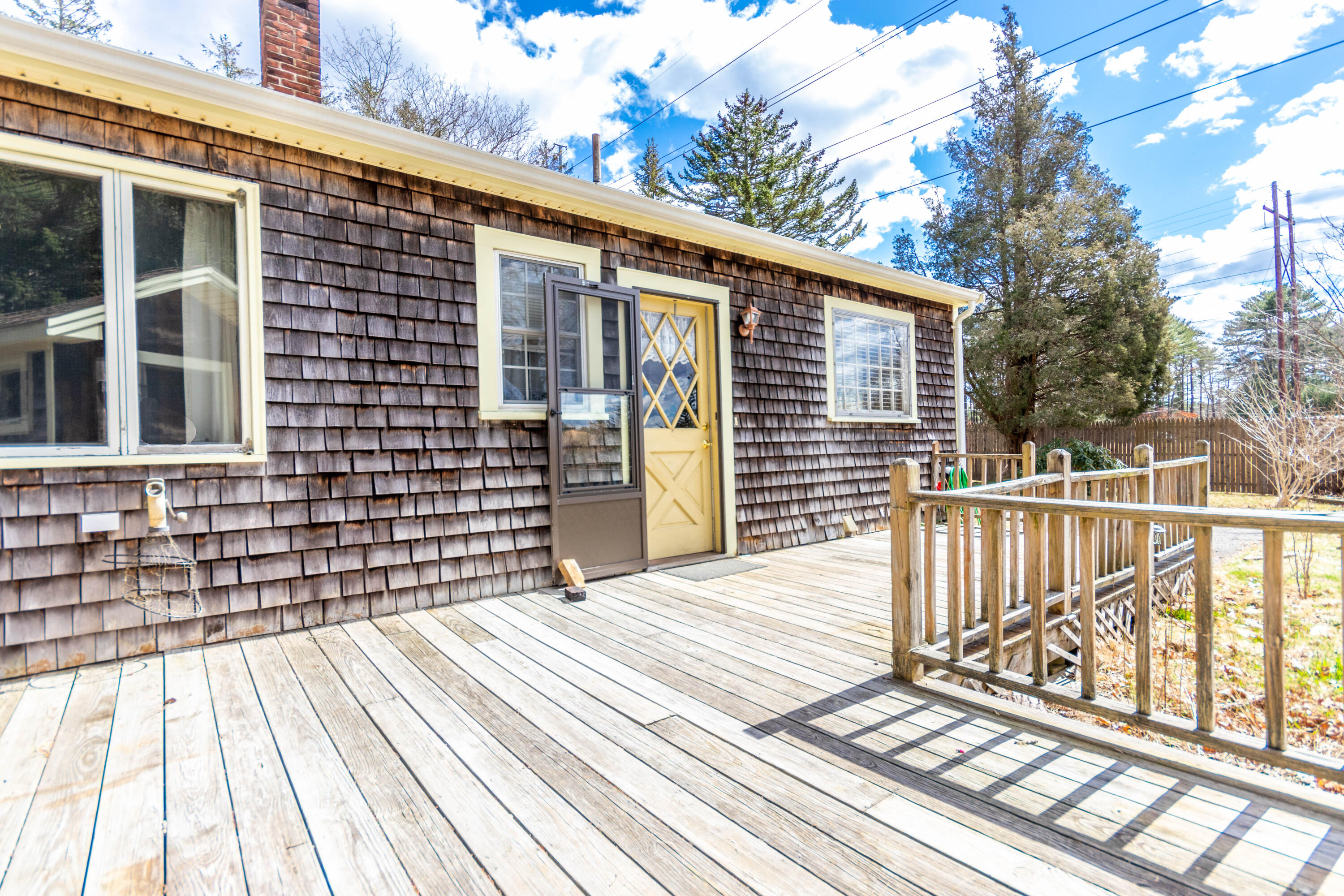 655 County Road Rochester, MA 02576 - Photo 23 of 26 a view of a brick house with large windows