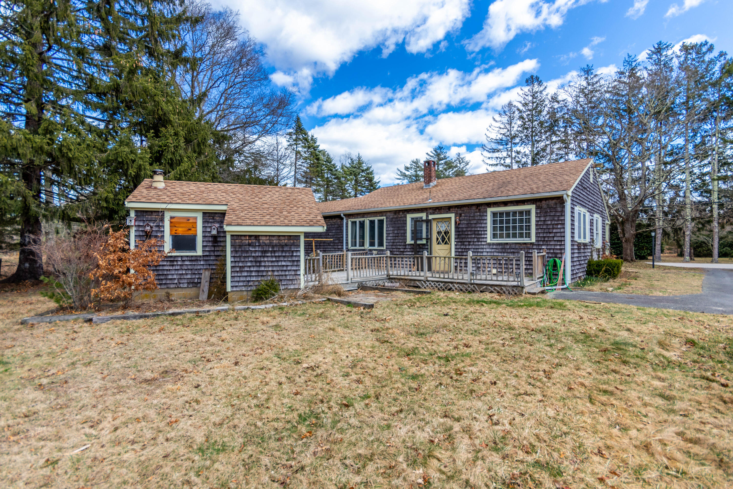 655 County Road Rochester, MA 02576 - Photo 3 of 26 a front view of a house with a garden