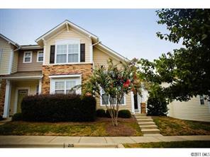 215 Dawn Mist Lane, Unit 215 Fort Mill, SC 29708 - Photo 1 of 16 a front view of a house with a yard