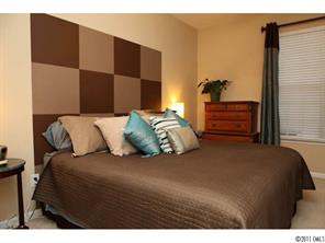 215 Dawn Mist Lane, Unit 215 Fort Mill, SC 29708 - Photo 11 of 16 a bedroom with a bed and a closet