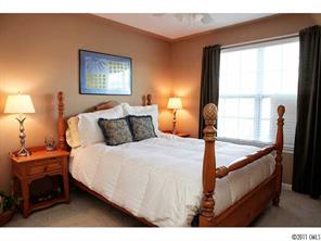 215 Dawn Mist Lane, Unit 215 Fort Mill, SC 29708 - Photo 14 of 16 a bedroom with a bed and a window