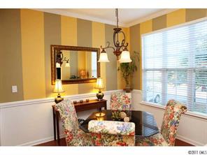 215 Dawn Mist Lane, Unit 215 Fort Mill, SC 29708 - Photo 3 of 16 a living room with furniture and a large window