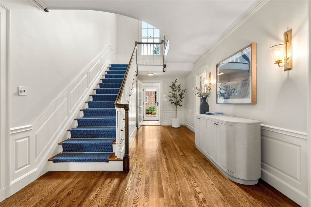 20 Foxcroft Road Winchester, MA 01890 - Photo 17 of 42 a view of a hallway with wooden floor and staircase