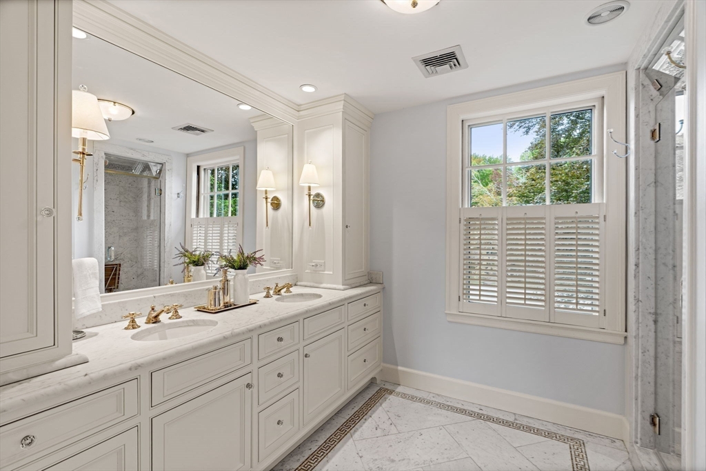 20 Foxcroft Road Winchester, MA 01890 - Photo 21 of 42 a spacious bathroom with double vanity a mirror a shower and a window