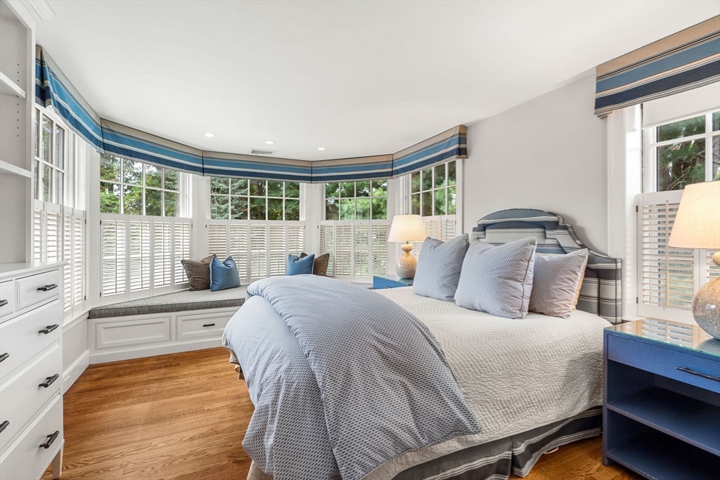 20 Foxcroft Road Winchester, MA 01890 - Photo 23 of 42 a bedroom with a bed and wooden floor