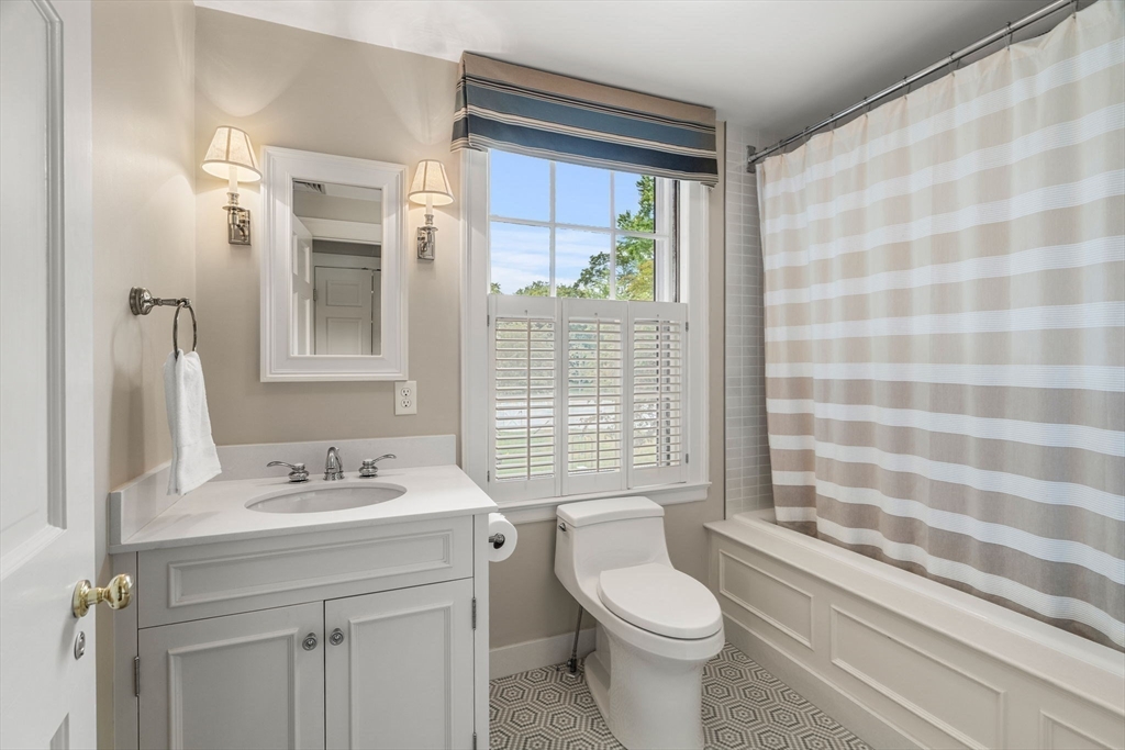 20 Foxcroft Road Winchester, MA 01890 - Photo 25 of 42 a bathroom with a sink a toilet and shower