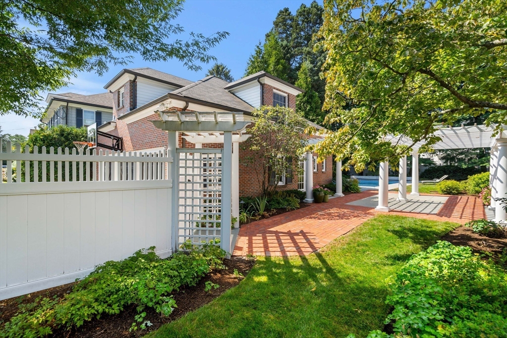 20 Foxcroft Road Winchester, MA 01890 - Photo 3 of 42 a front view of a house with a yard