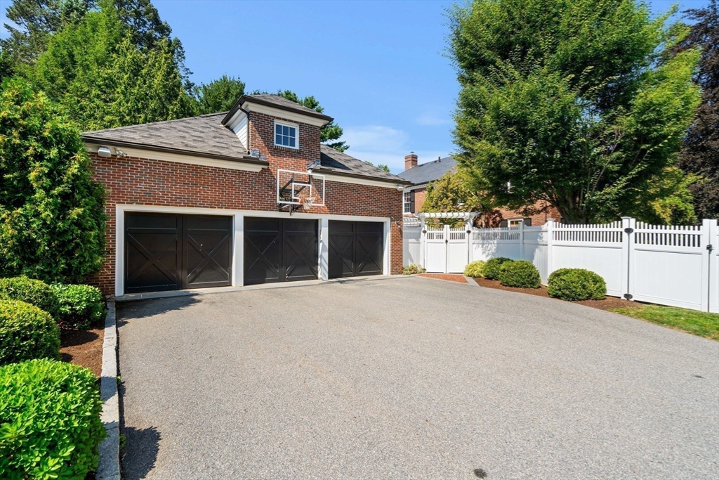 20 Foxcroft Road Winchester, MA 01890 - Photo 34 of 42 front view of a house with a yard and an trees