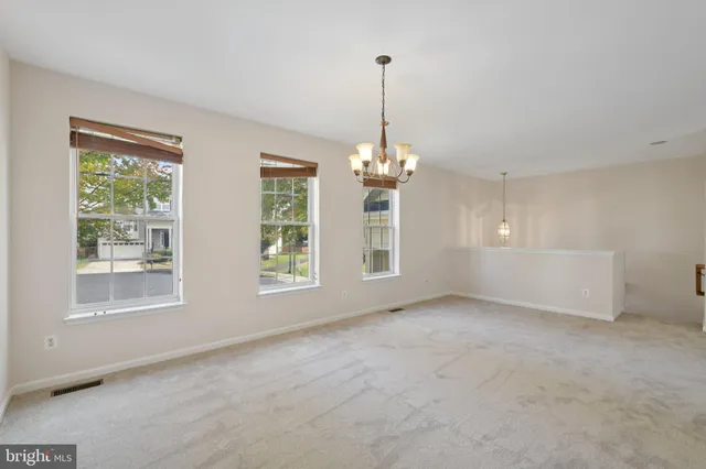 a view of an empty room with windows