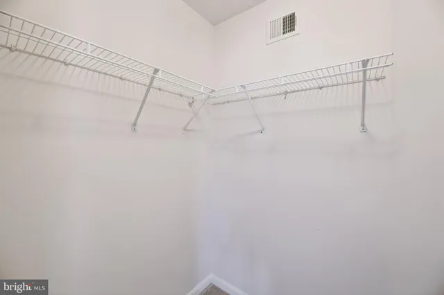 a view of a room with racks on the wall