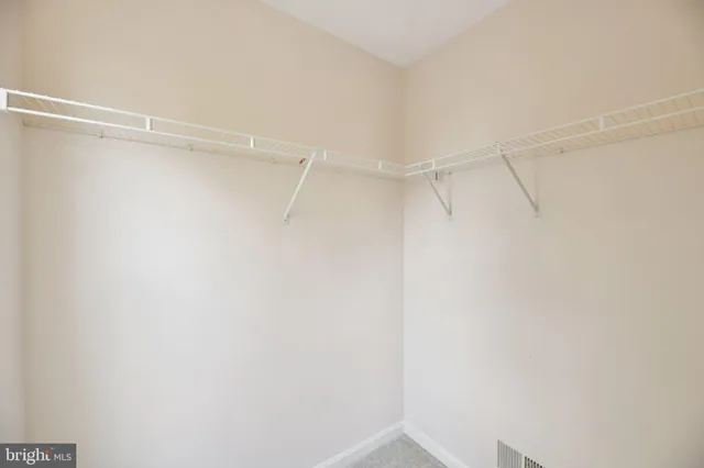 a view of a room with shelf on the wall