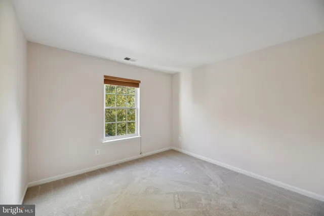 a view of a window in an empty room