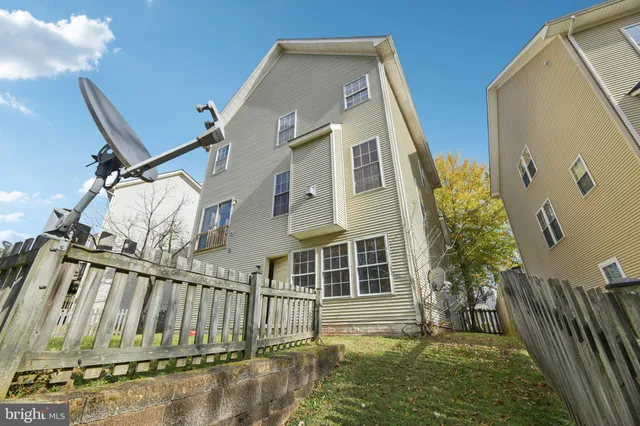 a view of a house with a small yard