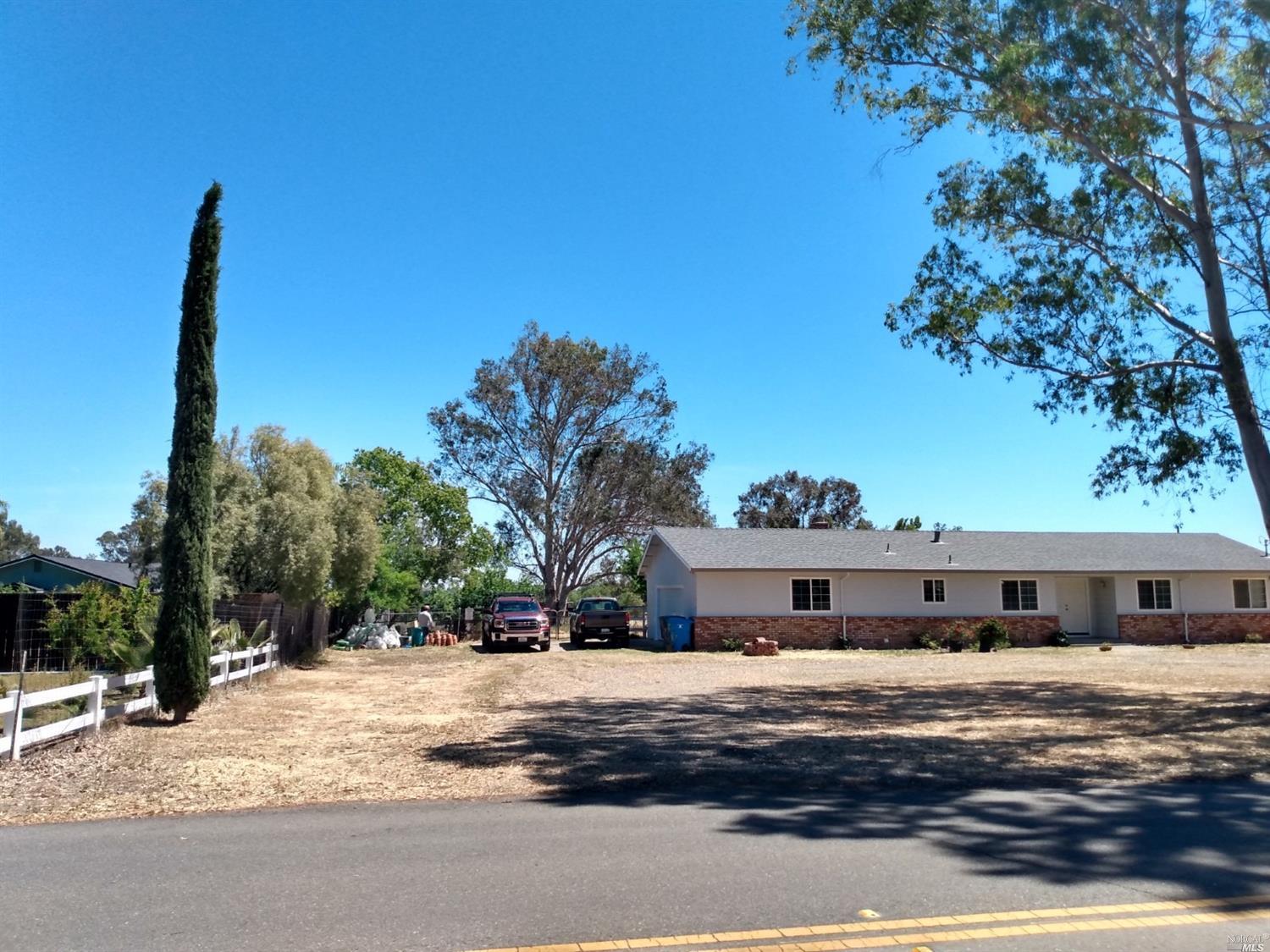 7592 Locke Road Vacaville, CA 95688 - Photo 1 of 1 a front view of a house with a yard