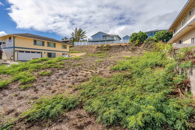 an aerial view of residential houses and outdoor space
