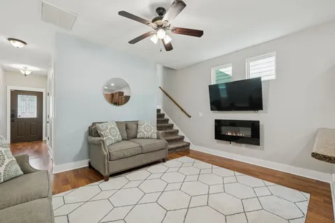 a living room with furniture and a flat screen tv