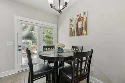 a view of a dining room with furniture and window