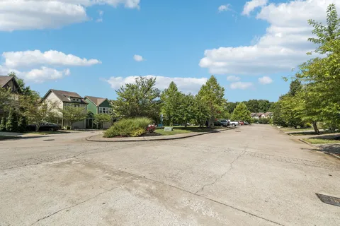 a view of a house and a yard