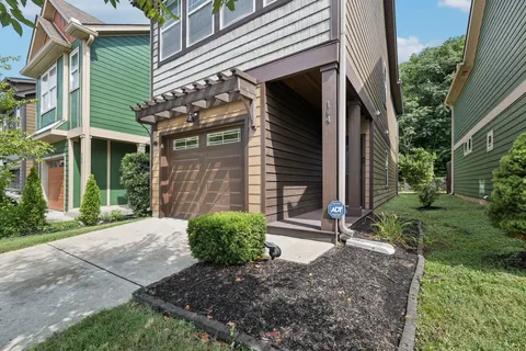 a view of a house with backyard and garden