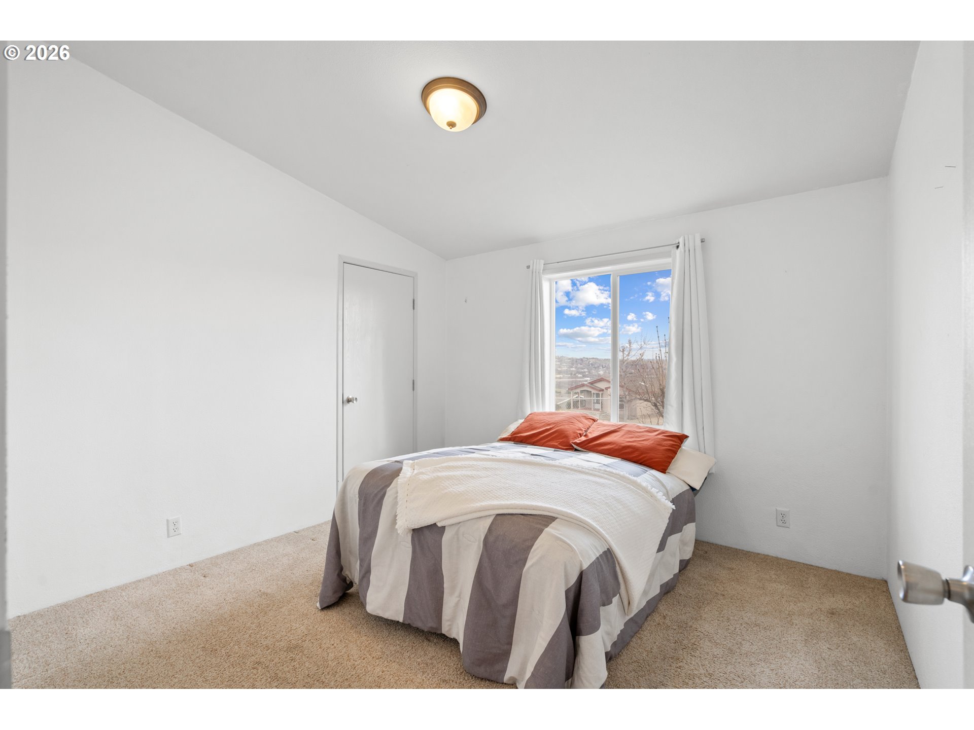 3127 Southwest River View Drive Pendleton, OR 97801 - Photo 17 of 33 a bedroom with a bed and window