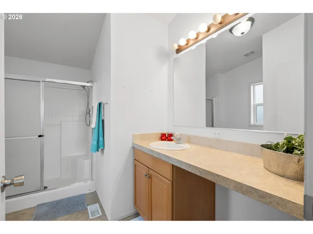 a bathroom with a sink and mirror