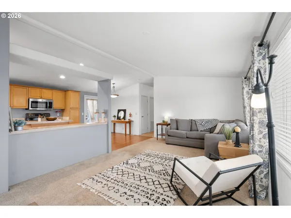 a kitchen with refrigerator and microwave