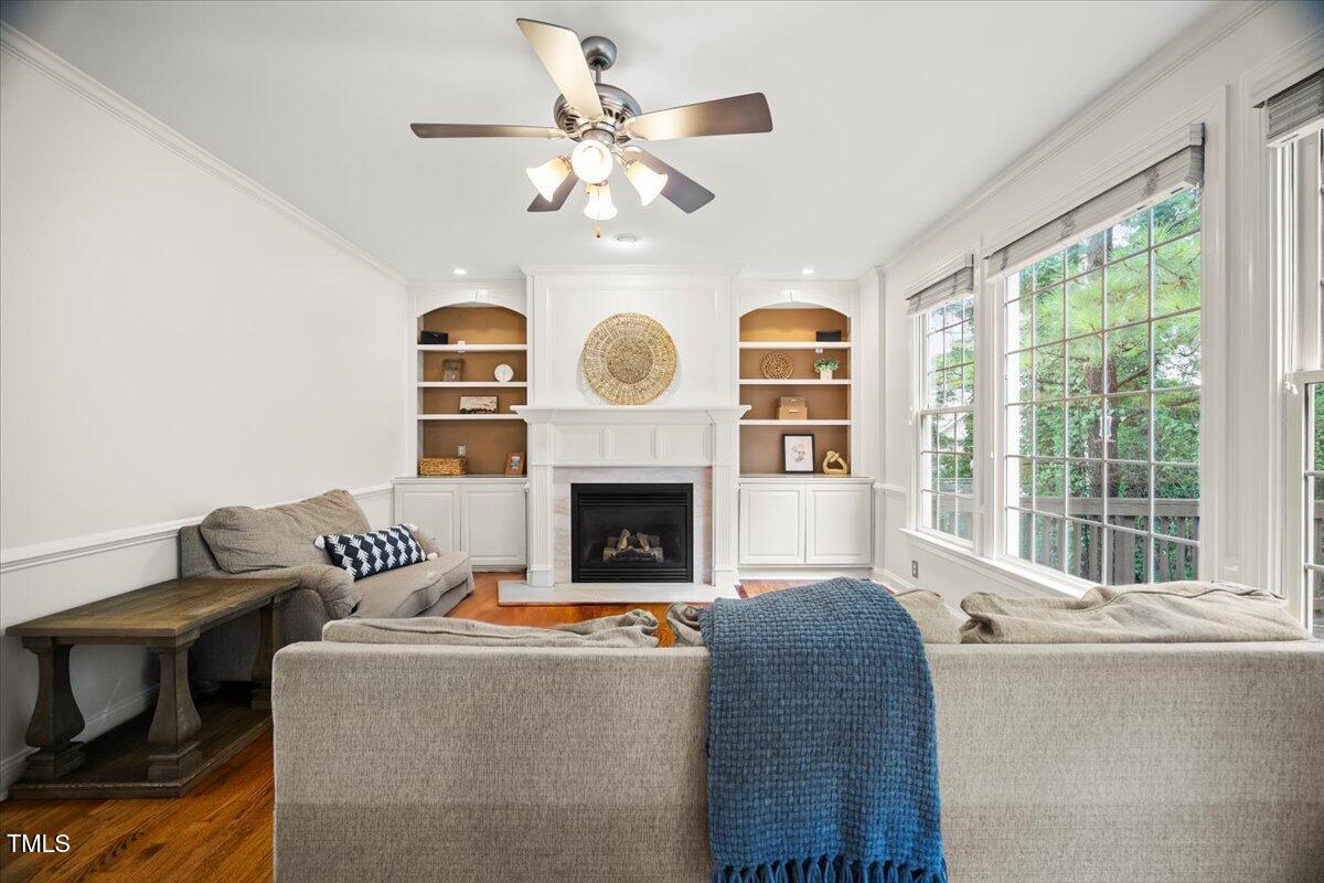 12204 Kaysmount Court Raleigh, NC 27614 - Photo 12 of 50 a living room with furniture a fireplace and a large window