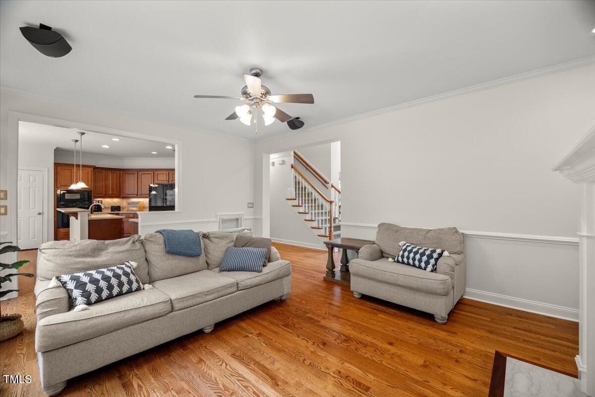 12204 Kaysmount Court Raleigh, NC 27614 - Photo 14 of 50 a living room with furniture and a wooden floor