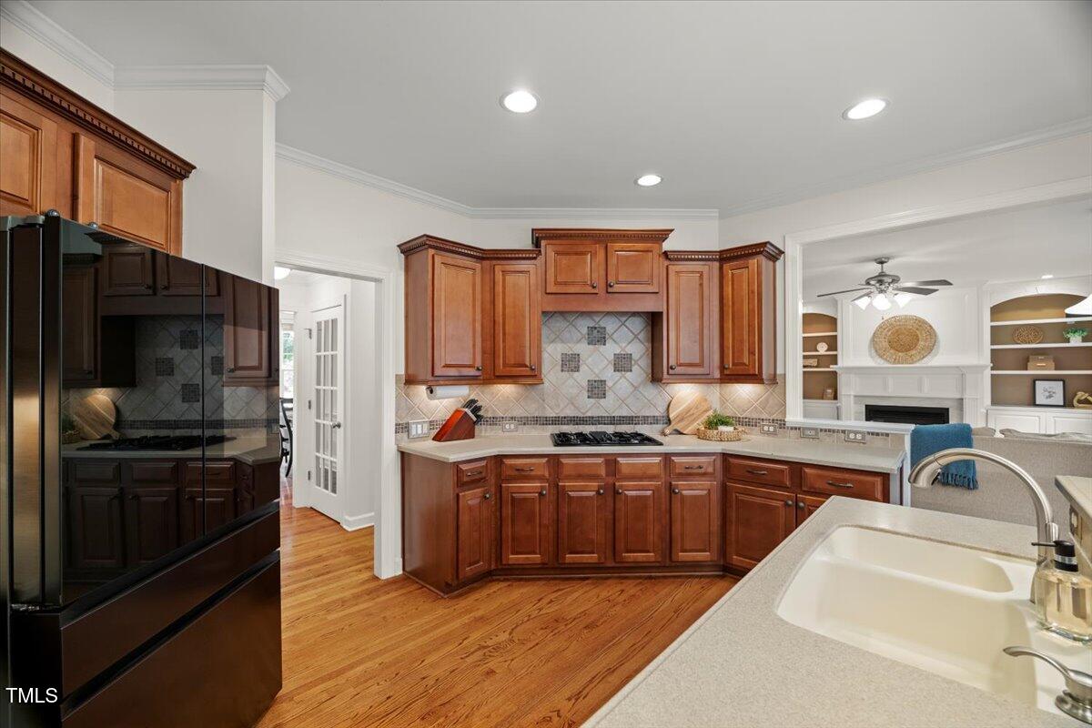 12204 Kaysmount Court Raleigh, NC 27614 - Photo 19 of 50 a kitchen with stainless steel appliances granite countertop a sink stove and refrigerator