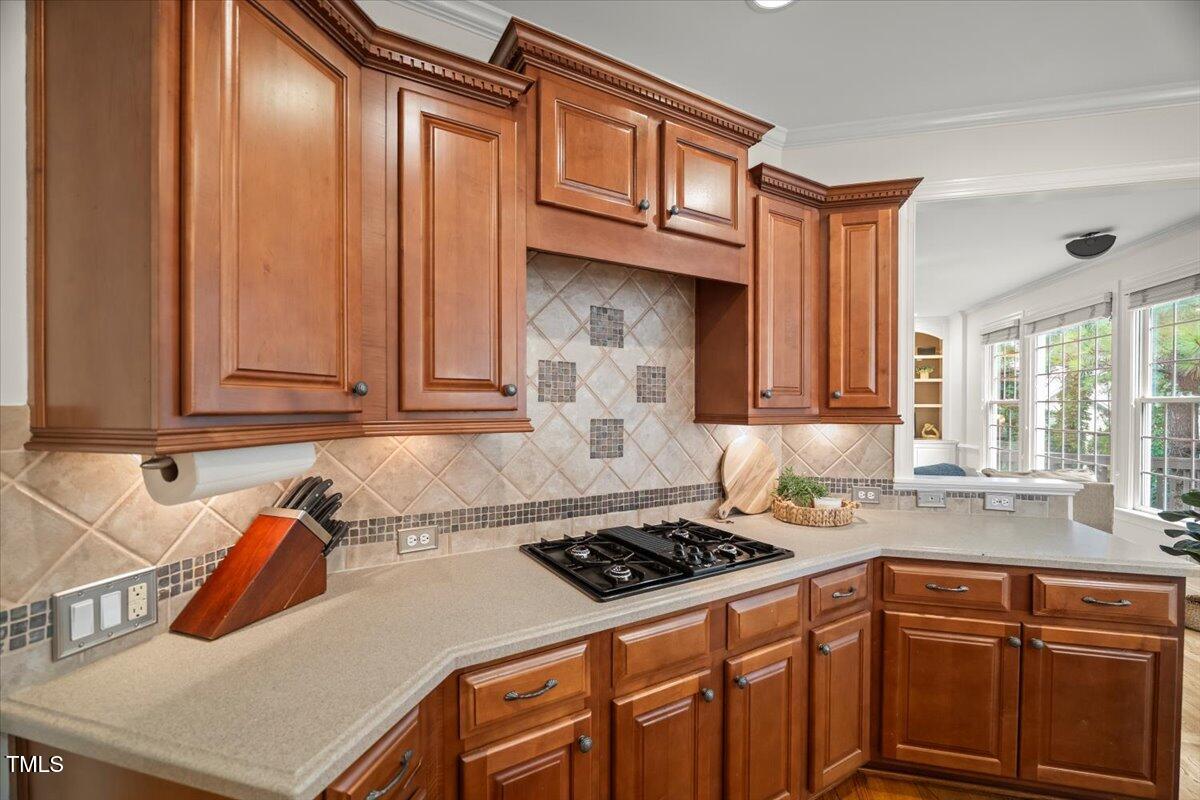12204 Kaysmount Court Raleigh, NC 27614 - Photo 20 of 50 a kitchen with stainless steel appliances granite countertop a sink stove and cabinets