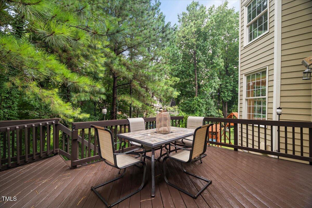 12204 Kaysmount Court Raleigh, NC 27614 - Photo 22 of 50 a view of a patio with a table and chairs