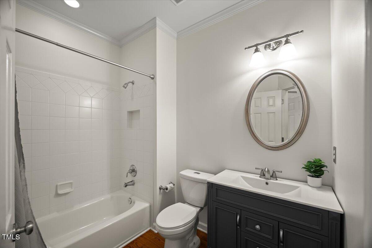 12204 Kaysmount Court Raleigh, NC 27614 - Photo 23 of 50 a bathroom with a sink toilet and a mirror