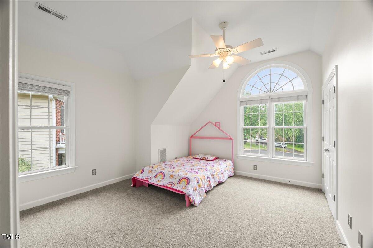 12204 Kaysmount Court Raleigh, NC 27614 - Photo 29 of 50 a bedroom with a bed and a window