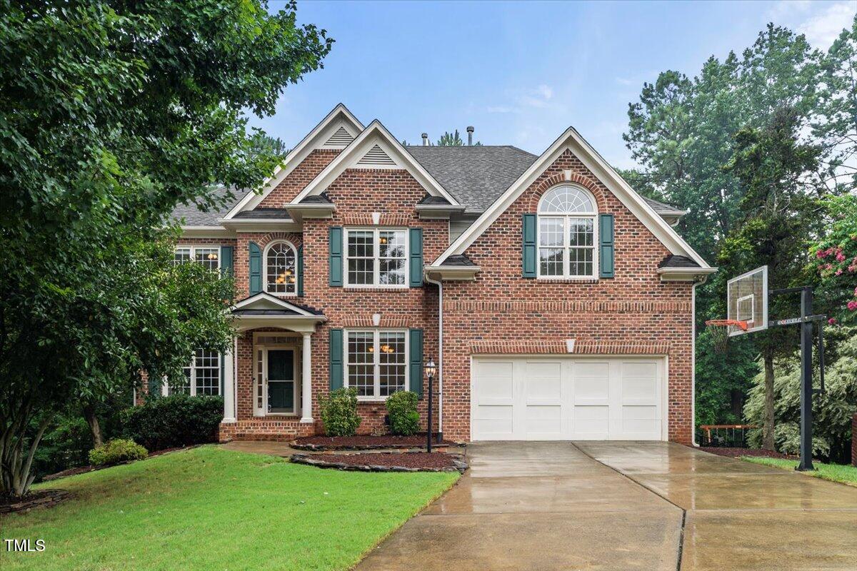 12204 Kaysmount Court Raleigh, NC 27614 - Photo 2 of 50 a front view of a house with a yard and trees