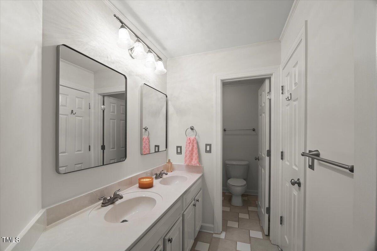 12204 Kaysmount Court Raleigh, NC 27614 - Photo 30 of 50 a bathroom with a sink a toilet and shower