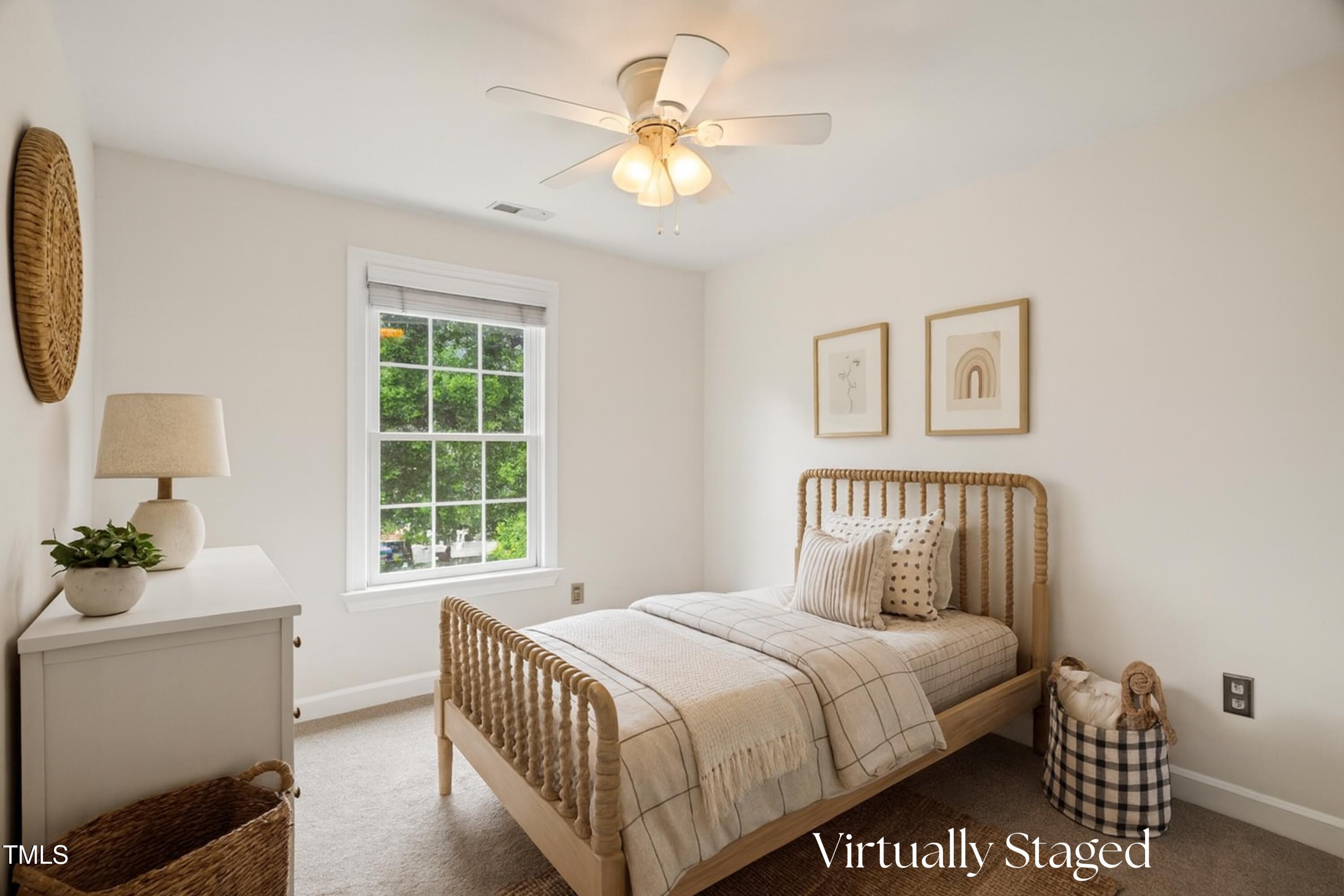 12204 Kaysmount Court Raleigh, NC 27614 - Photo 33 of 50 a bedroom with a bed and a chandelier