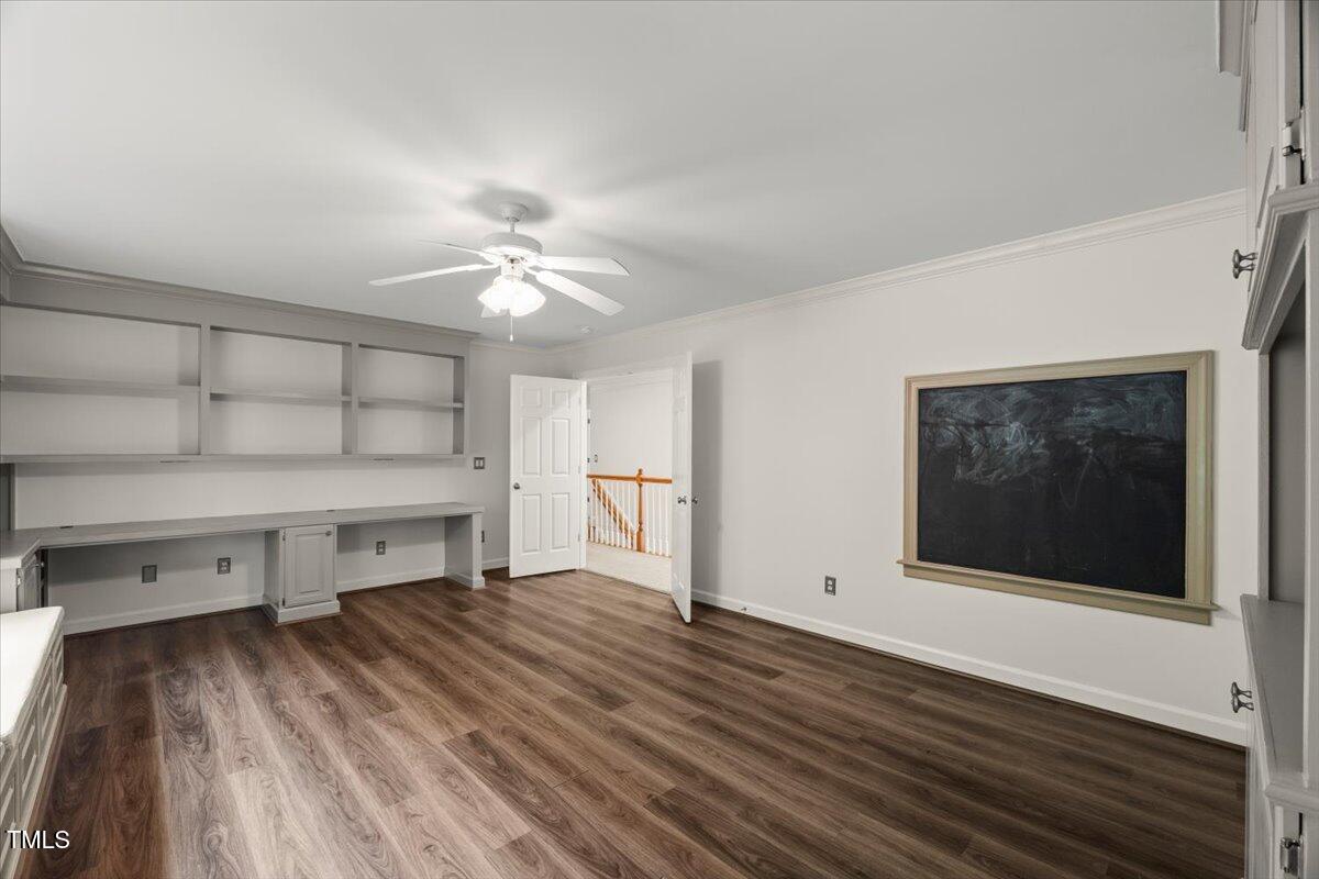 12204 Kaysmount Court Raleigh, NC 27614 - Photo 37 of 50 a view of empty room with wooden floor and fan