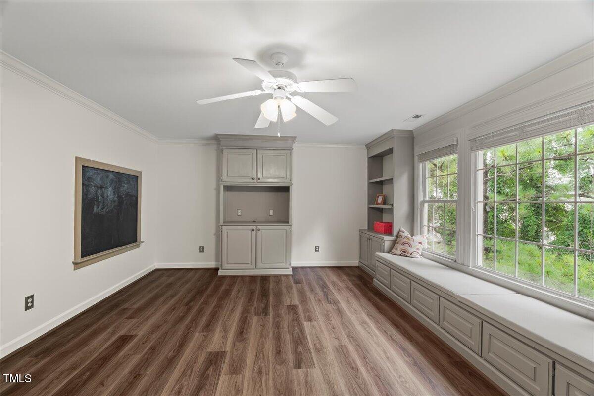 12204 Kaysmount Court Raleigh, NC 27614 - Photo 38 of 50 a view of empty room with wooden floor and fan