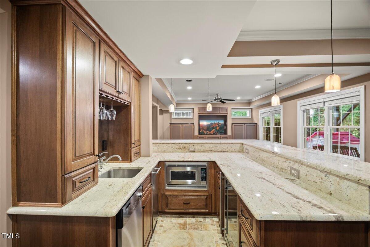 12204 Kaysmount Court Raleigh, NC 27614 - Photo 42 of 50 a kitchen with a sink stove and cabinets