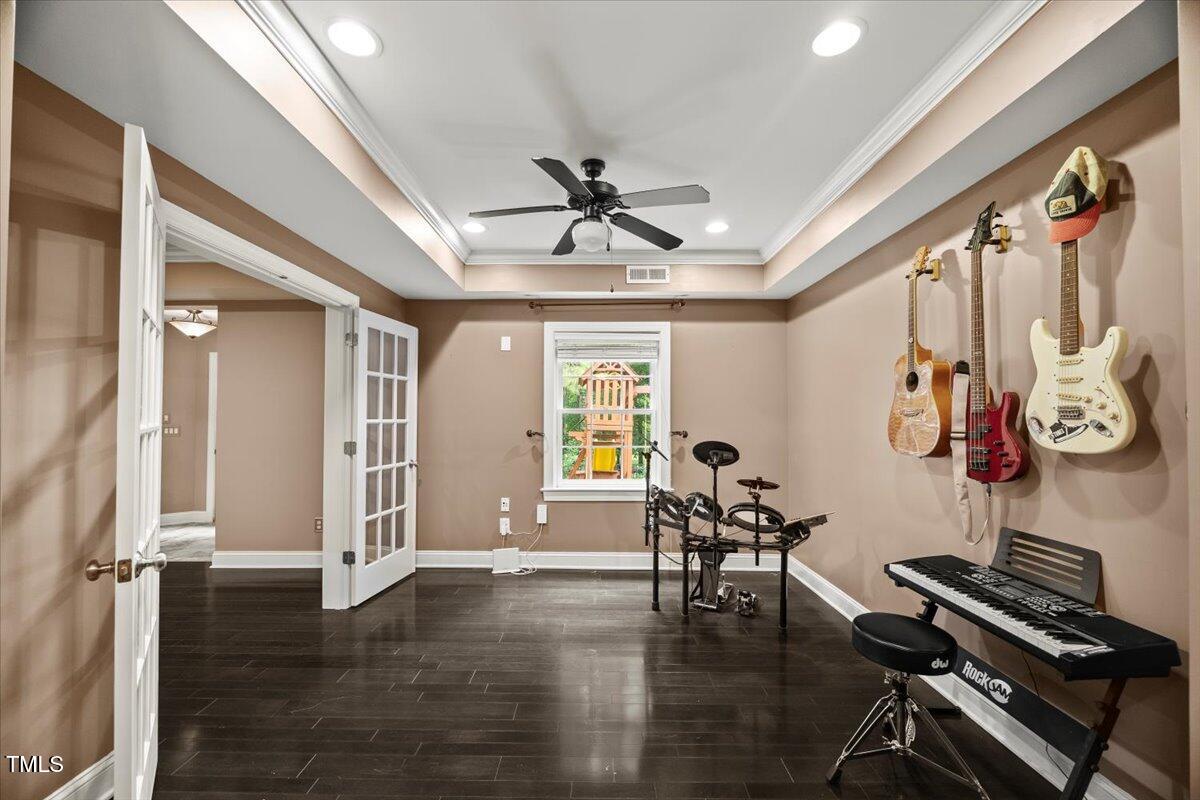 12204 Kaysmount Court Raleigh, NC 27614 - Photo 44 of 50 a view of room with furniture wooden floor and window
