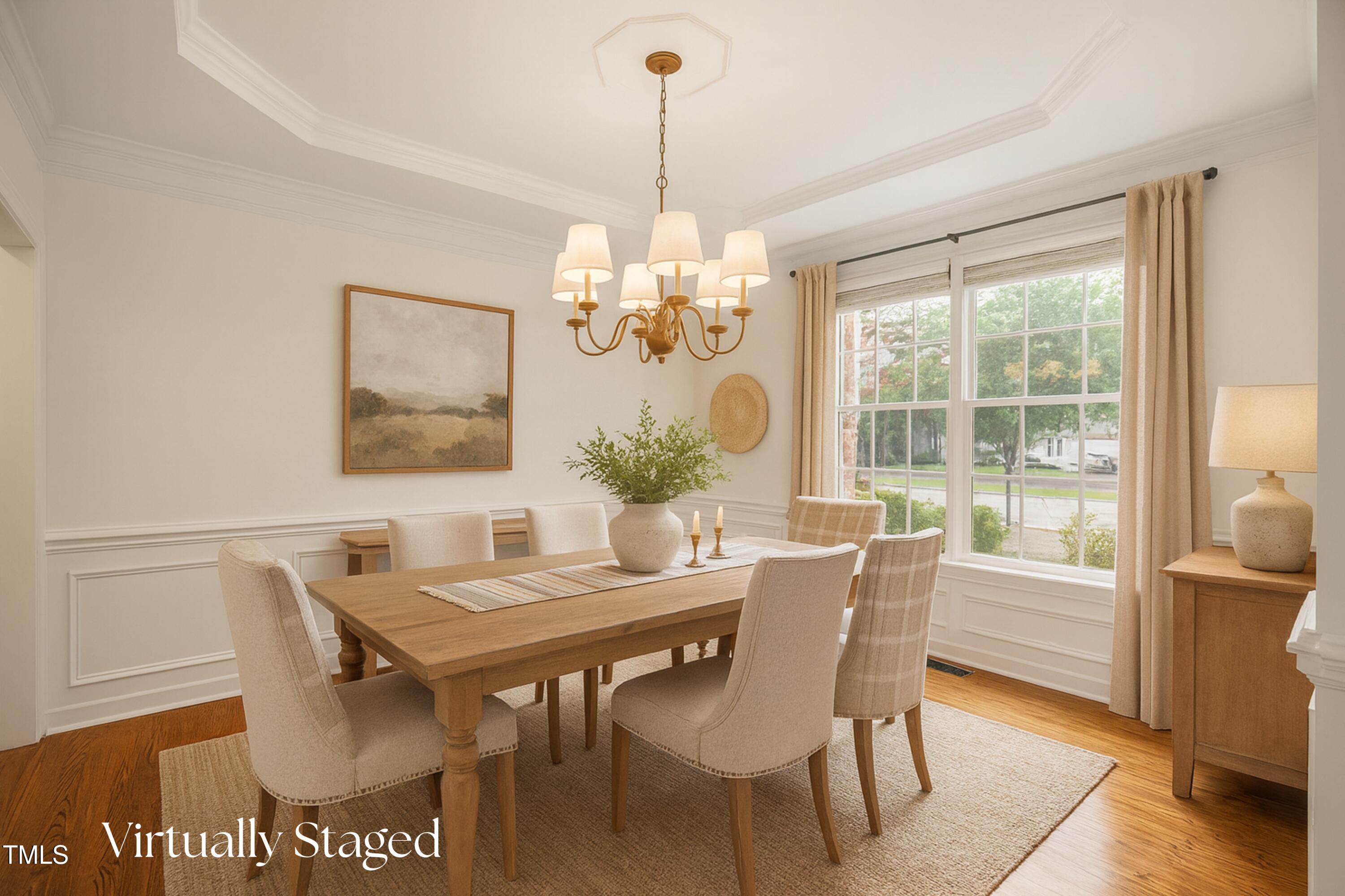 12204 Kaysmount Court Raleigh, NC 27614 - Photo 8 of 50 a dining room with furniture a rug and wooden floor