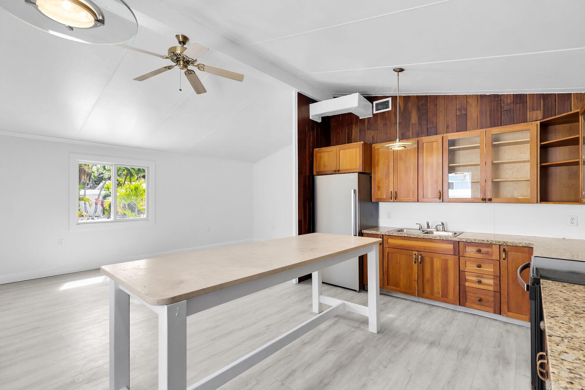 417 95th Street Marathon, FL 33050 - Photo 15 of 28 a view of kitchen with stainless steel appliances cabinets and wooden floor