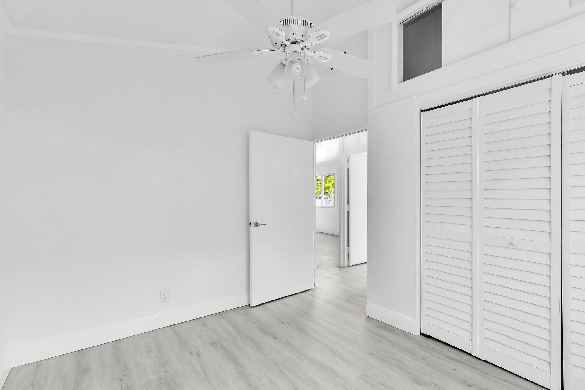 417 95th Street Marathon, FL 33050 - Photo 17 of 28 wooden floor in an empty room with a window