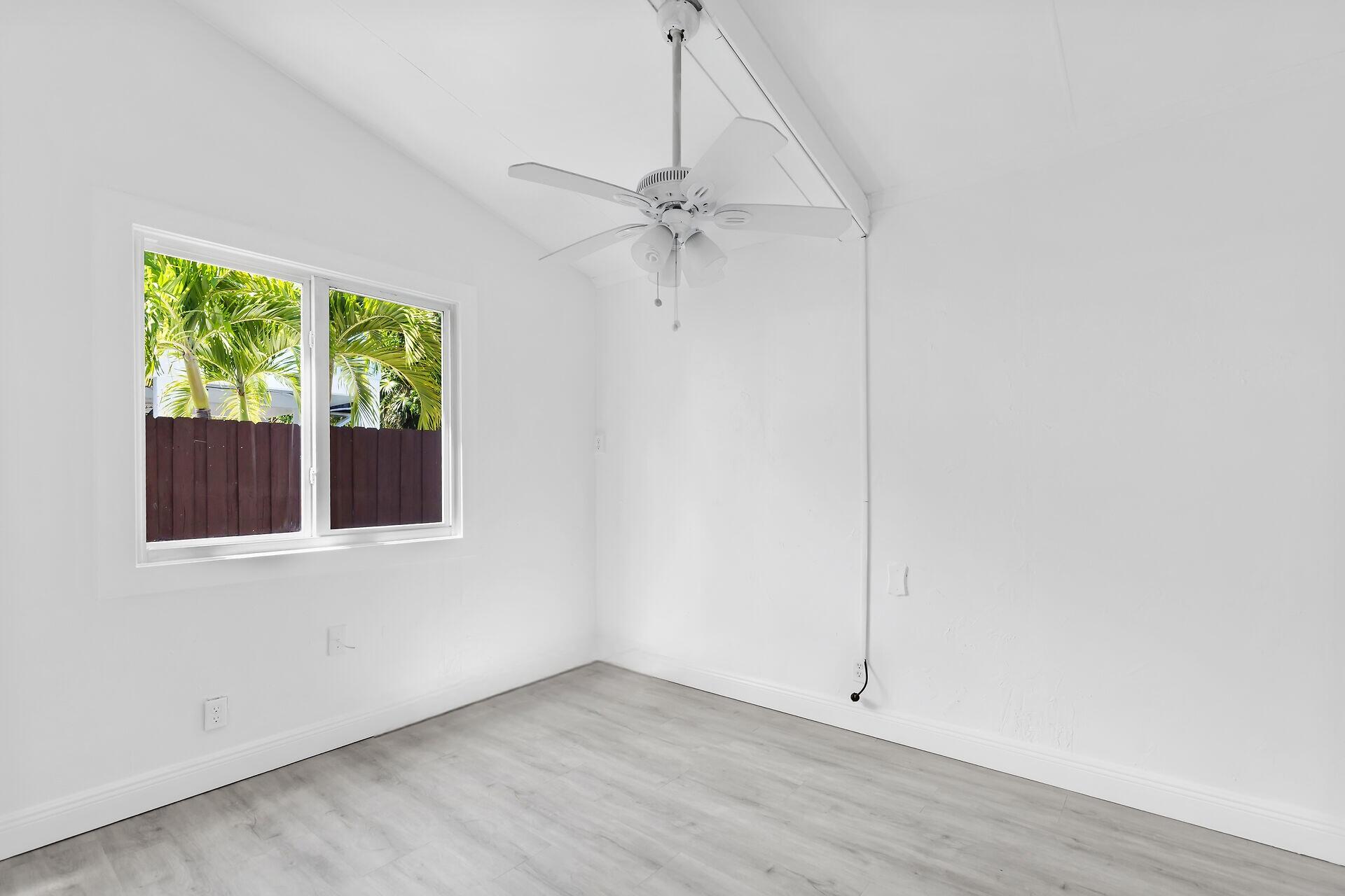 417 95th Street Marathon, FL 33050 - Photo 18 of 28 an empty room with a window and a ceiling fan