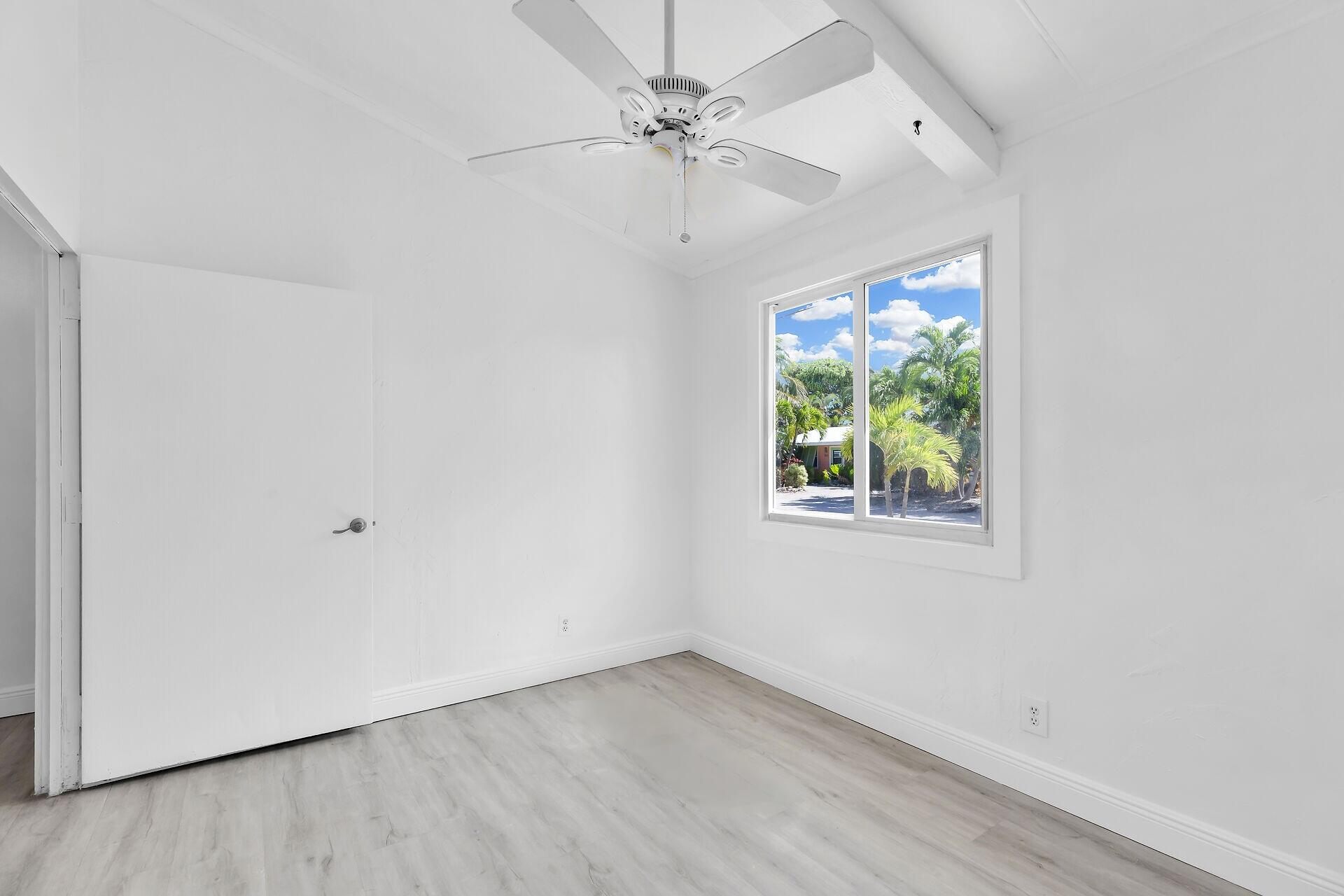 417 95th Street Marathon, FL 33050 - Photo 22 of 28 an empty room with a window and a ceiling fan